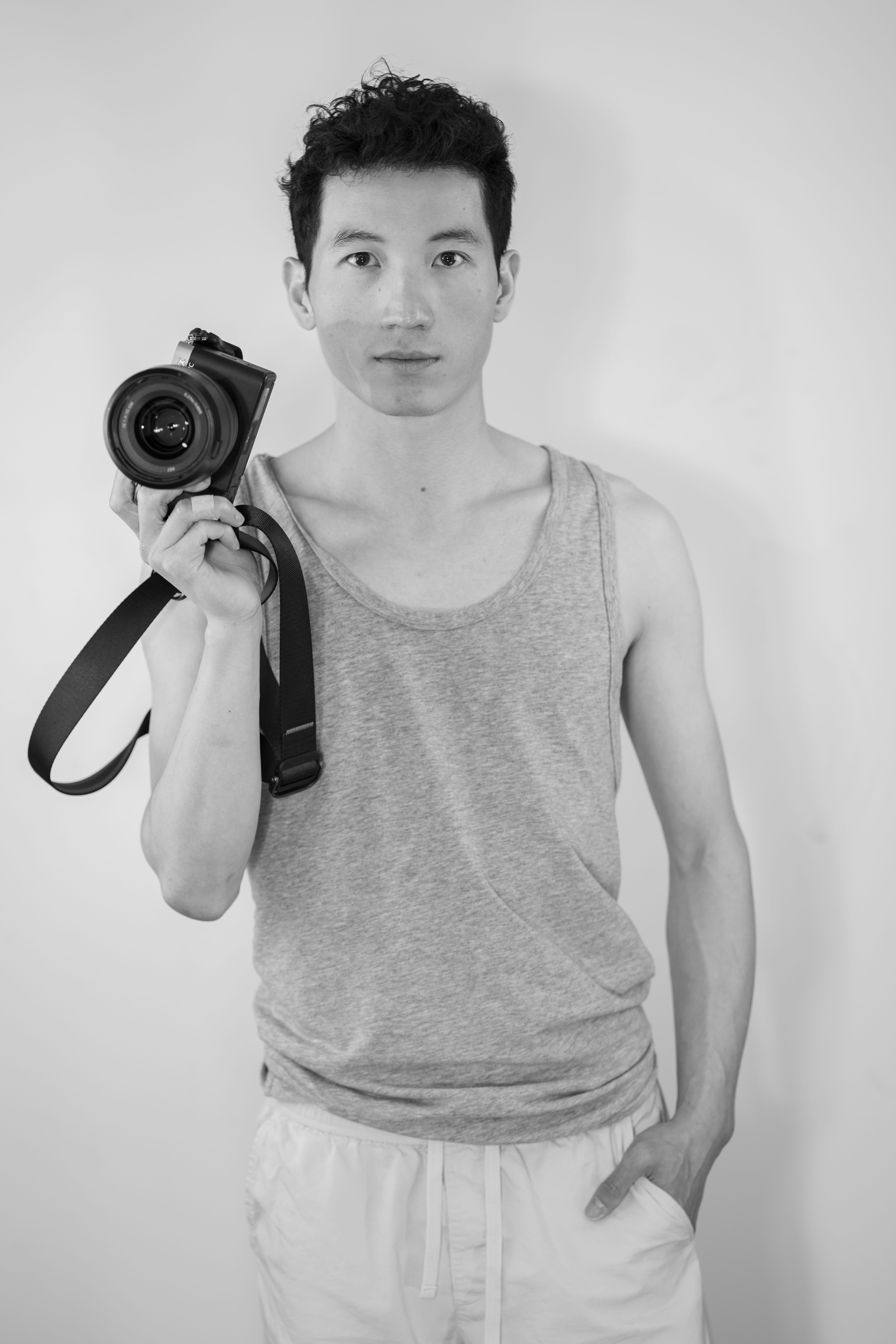 Justin Liu holding a camera